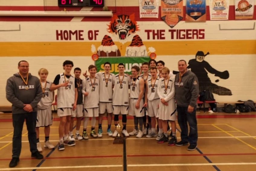 The Exploits Valley High Eagles male basketball team recently won the gold medal at the 4th annual Caroline Penney Memorial Tiger Cup in Torbay, after a 90-61 victory over the host Holy Trinity Tigers in the final. Members of the team include, front row, from left, coach Nathan Sullivan, Evan Pardy, Adam Cooke, Kyle Bursey, Sevan Steele, Steven Mercer, Colton Connors, Ethan Lush, Josh Oldford, Colin O’Driscoll, Ethan Pardy and coach Brian Cooke; back row, from left, Andrew Welsh and Aiden Decker. CONTRIBUTED