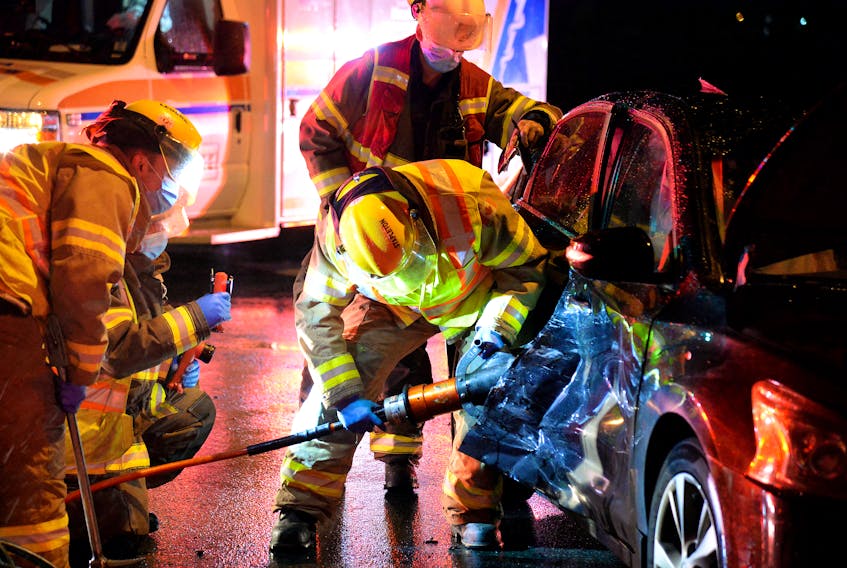 Extrication tools had to be used to free one of three people injured in a collision in St. John's Wednesday night. Keith Gosse/The Telegram
