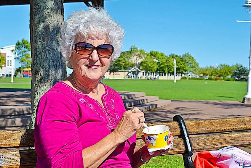Joan Watkins, from Woodhull, New York, enjoys a Cow’s ice cream near Confederation Landing Park, Sept. 12. If the fall forecast holds true, there could still be plenty of days left to enjoy a tasty treat outdoors.