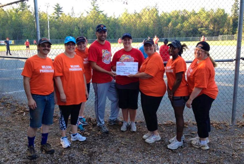 <p>Wilsons Pharmasave donated $500 to the families at a softball tournament held in Aylesford July 25-27. The tournament saw more than 200 people play ball to raise funds and honour the memories of three Moncton Mounties who were killed in June.</p>