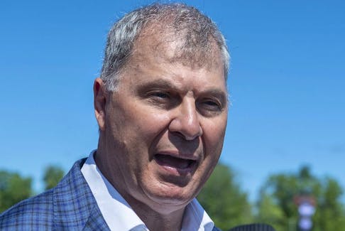 Randy Ambrosie, commissioner of the Canadian Football League, talks with reporters before the Montreal Alouettes and Toronto Argonauts game in Moncton, N.B. on Sunday, Aug. 25, 2019.