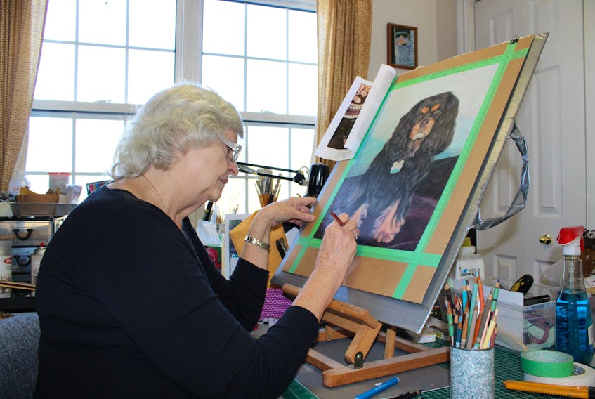 Sharon Hicks works on a commissioned pet portrait in her studio last week. Hicks will be the featured artist for the Sackville Art Association’s annual members’ showcase.