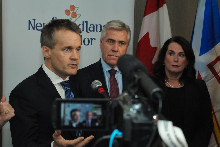 From left, federal Natural Resources Minister Seamus O’Regan, Premier Dwight Ball and Natural Resources Minister Siobhan Coady speak with reporters following a news conference at Memorial University’s Signal Hill campus on Monday. Joe Gibbons/The Telegram
