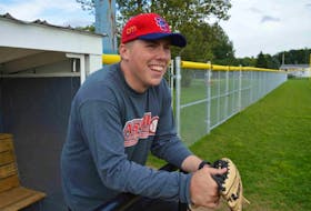 <p>Catcher Sean Ferguson of the Sydney Sooners laughs while enduring a steady stream of friendly chirps from his teammates at team practice on Thursday. The 23-year-old from Howie Centre is back behind the plate after suffering a cardiac arrest on June 9.</p>
