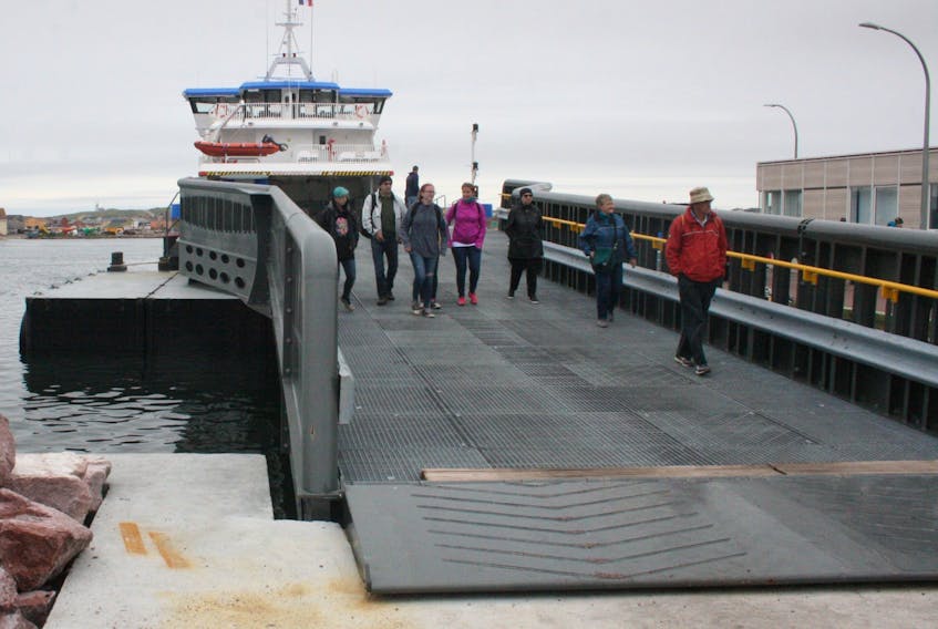 Passengers depart French ferry Suroît after docking in St. Pierre in this file photo.