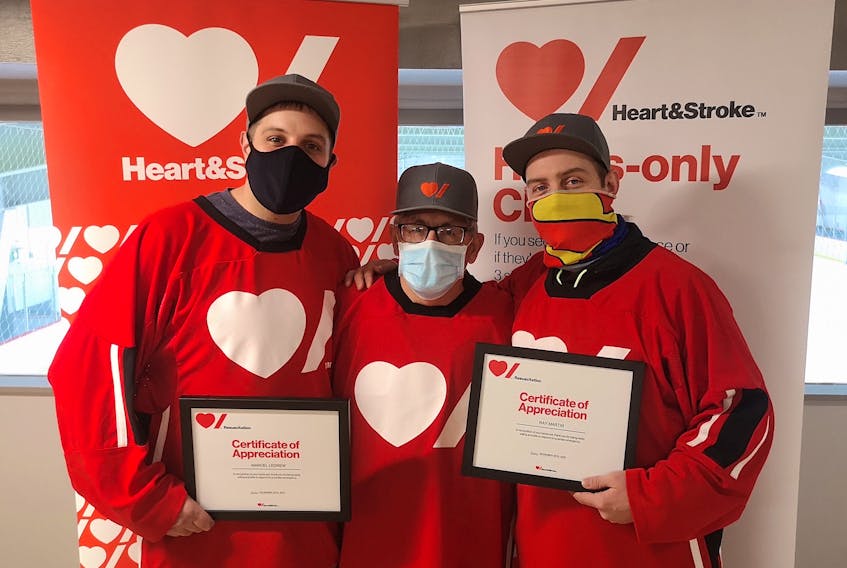 After Larry Manning (centre) suffered a heart attack, two employees at Twin Rinks in St. John’s, Marcel Ledrew (left) and Ray Martin (right), responded quickly and used an automated external defibrillator (AED) to save his life. – Andrew Waterman/The Telegram