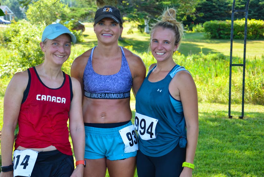 Jessica Forgie, right, was the second female finisher in the 46th annual Harvest Festival 25-Kilometre Road Race on Saturday morning. Forgie, who lives near Ottawa, had a time of two hours one minute (2:01:00). Helga Reisch-MacNeill, left, of Kensington was the top female runner in 1:53:20 while Leanne Vessey, centre, of York, P.E.I., was the third overall female with a time of 2:03:39.