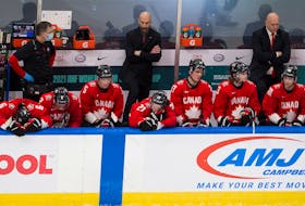 The Team Canada bench waits for time to expire during the final moments of a 2-0 loss to the United states in the championship game of the world junior hockey championship Tuesday in Edmonton. 