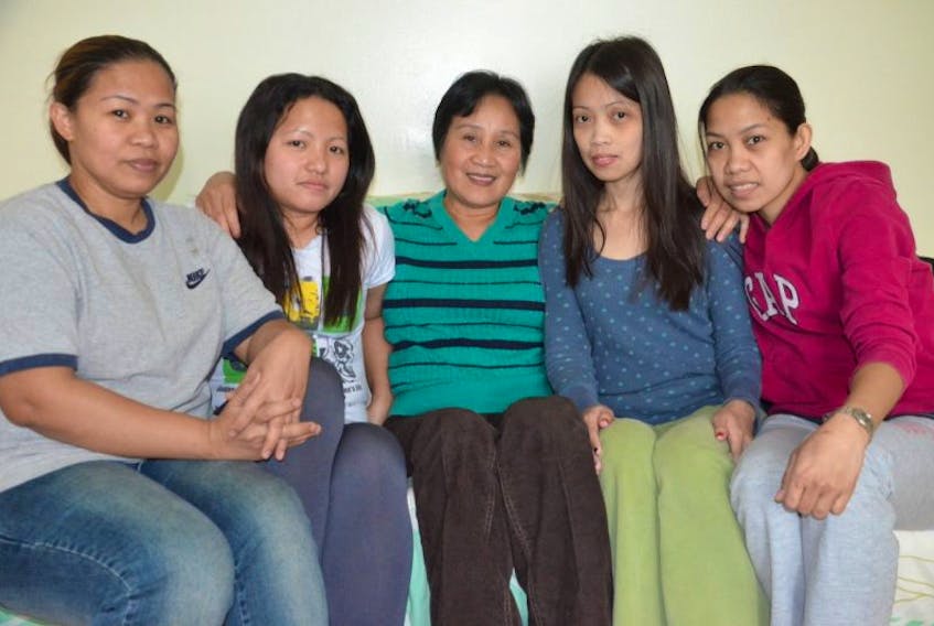 Many members of the local Filipino community are waiting to hear from friends and family back home who are struggling to recover from&nbsp;<span>Typhoon Haiyan. From left are Zheny Angeles, Nelia Anadia, Fanny Villarama, Jennifer Trinidad and Marissa Hermano. Colin MacLean/Journal Pioneer</span>