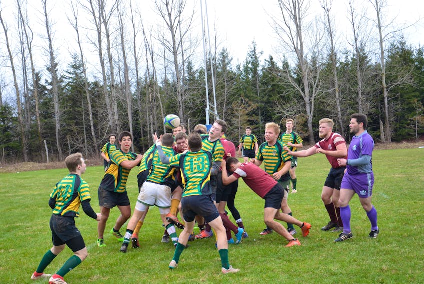 The host Three Oaks Axemen, striped jerseys, and Colonel Gray Colonels battle in the championship game of the 23rd annual David Voye Memorial rugby tournament. The Axemen won the final, played at the Canada Games pitch on the campus of Three Oaks Senior High School in Summerside, by a 28-0 score.