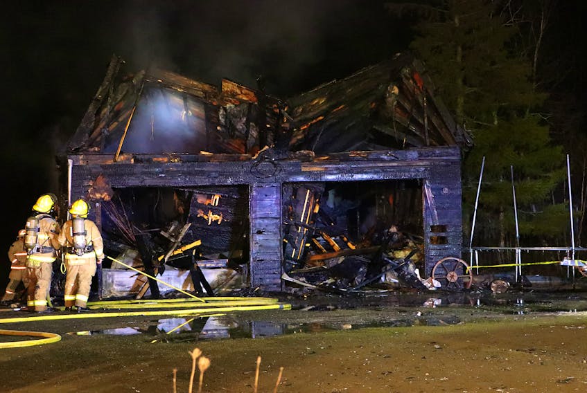 Flames reduced this two-storey residential garage on Chute Road to a charred shell on Sunday evening. – Adrian Johnstone