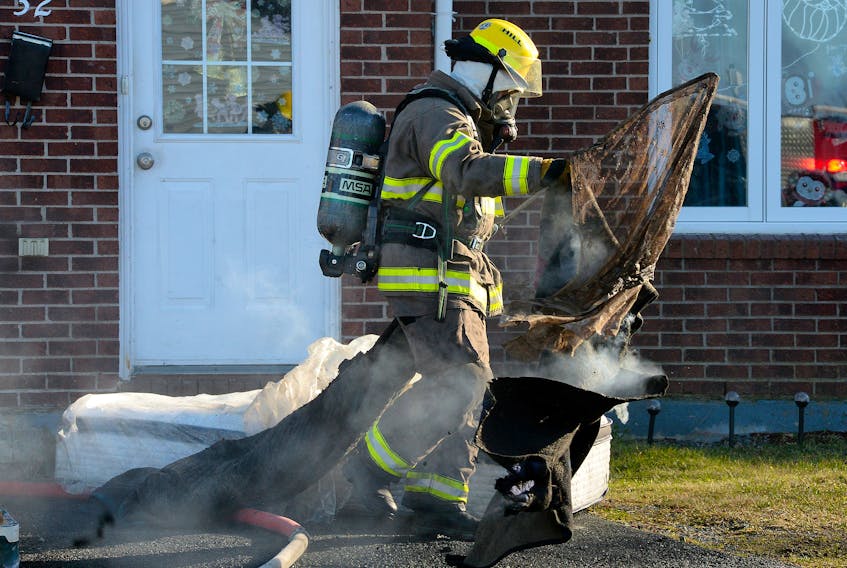 Firefighters made quick work of a house fire in Shea Heights Friday morning. Keith Gosse/The Telegram
