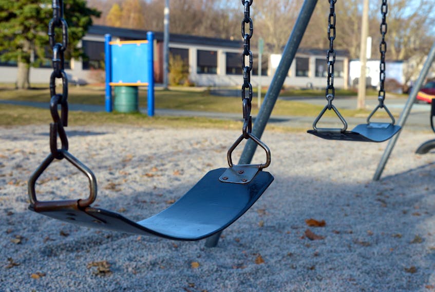 Swings hang empty in a St. John’s schoolyard Monday afternoon. Keith Gosse/The Telegram