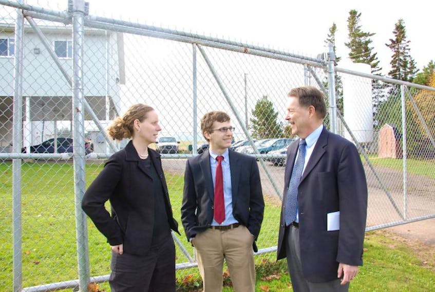 In this Guardian file photo, Lucy Sharratt, from left, with the Canadian Biotechnology Action Network, talks with Eric Hoffman, with Friends of the Earth U.S. and Jaydee Hanson, a policy analyst with the U.S.-based Centre for Food Safety, at the AquaBounty facility in Fortune. They were there for a news conference to voice concerns about the company's genetically modified salmon.