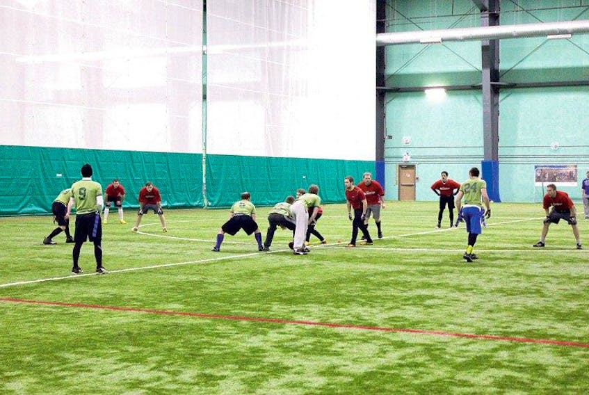 Players line up for the snap during a Newfoundland Flag Football League at the Techniplex indoor facility in Pleasantville. The league, now in its second year, is hoping to expand from four teams to six for next season. The circuit’s 16-game season finishes up Thursday with the final at 10 p.m. featuring The Thieves and Flying Pigs.