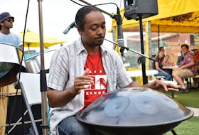 Steelpan musician Pepeto Pinto plays one of his drums and was the second act of the day at the Peake's Quay floating dock on Canada Day.