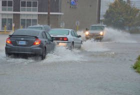 <p>Motorists made their way through a flooded section of Prince Street in Sydney, Monday afternoon as heavy rain continued to fall. Several roads were blocked due to flooding in low-lying areas of the CBRM.</p>