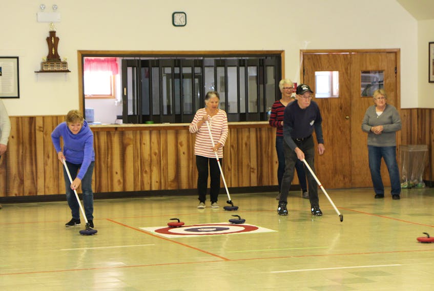 Participants enjoying floor curling at the Arisaig Community Centre, during a recent Thursday evening session.