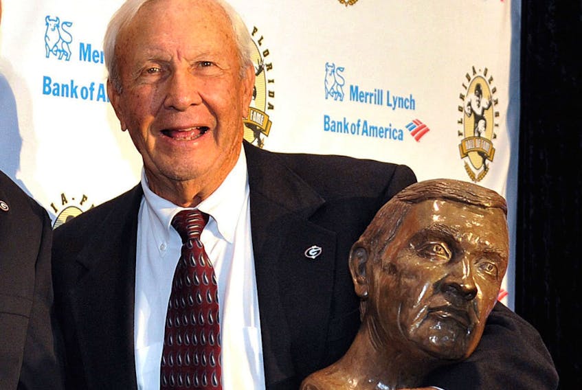 Pat Dye poses with his busts after an induction ceremony at the Georgia-Florida Hall of Fame on Oct. 31, 2014, in Jacksonville,Fla.