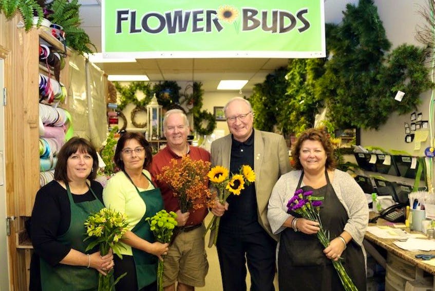From left, Sandra Walsh, co-owner of Flowerbuds, Irene Gallant, Mike Robison, Premier MacLauchlan and Vikki Sweeney, co-owner Flowerbuds.