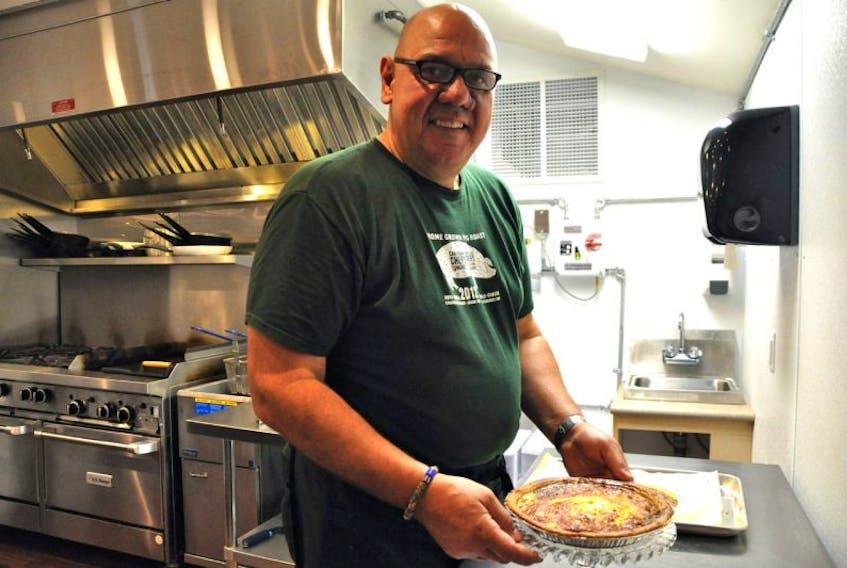 <p>Chef Chris Velden prepares a quiche for patrons at the Flying Apron. The business has been open in Summerville since Aug. 1.</p>