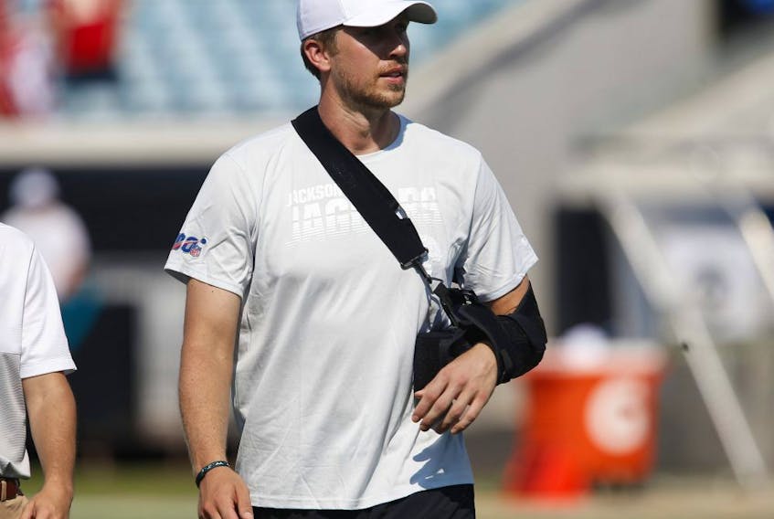 An injured Jacksonville Jaguars quarterback Nick Foles walks on the field with his arm in a sling following a game against the Kansas City Chiefs at TIAA Bank Field. (REINHOLD MATAY/USA TODAY Sports)