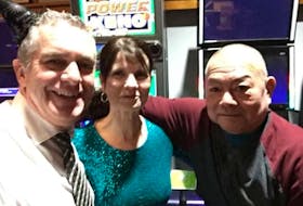 Carbonear Mayor Frank Butt (left) with Fong’s Restaurant owners Art Fong and Fong's wife, Michelle, at the restaurant’s annual New Year’s Eve ball on Jan. 1, 2020. Contributed photo 