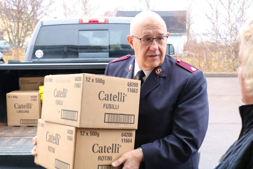In this Journal Pioneer file photo, Major Wayne Green of the Summerside Salvation Army carries in boxes of pasta donated by Consolidated Credit Union in Summerside. Millicent McKay/Journal Pioneer