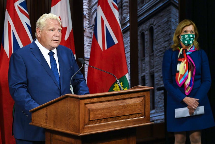 Ontario Premier Doug Ford makes an announcement with Health Minister Christine Elliott during the COVID-19 pandemic in Toronto on Thursday, September 24, 2020.