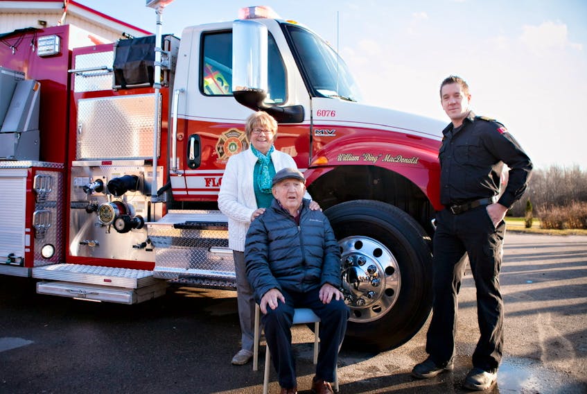 The Florence Volunteer Fire Department honoured founding member William (Ding) MacDonald by naming its new 1,500-gallon tanker after him. MacDonald, with wife Edna and Chief Adam MacIntyre, was honoured at a ceremony at the Florence Fire Station on Saturday. MacDonald and Chuck Porter are the only two remaining members from the volunteer group that founded the Florence Volunteer Fire Department in 1961. CONTRIBUTED • WHITE PHOTOGRAPHY