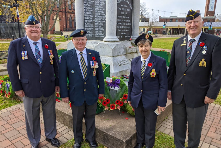Veterans Gene Bell, Noel Lannon, Charlene Lannon and Allan Wellwood with a wreath by the Colchester-East Hants Branch of the National Association of Federal Retirees at the Truro Cenotaph. After laying the wreath they went for lunch at Fletcher's Restaurant where a stranger took care of their bill.