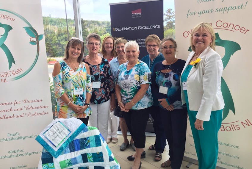 Bonnie Morgan, who has been battling ovarian cancer for the past 10 years, is surrounded by "Bonnie's Buddies," a group of ladies that have donated a teal-coloured quilt for the last three years to raise funds for ovarian cancer research. So far, $15,000 has been raised. Teal is the colour of ovarian cancer. 