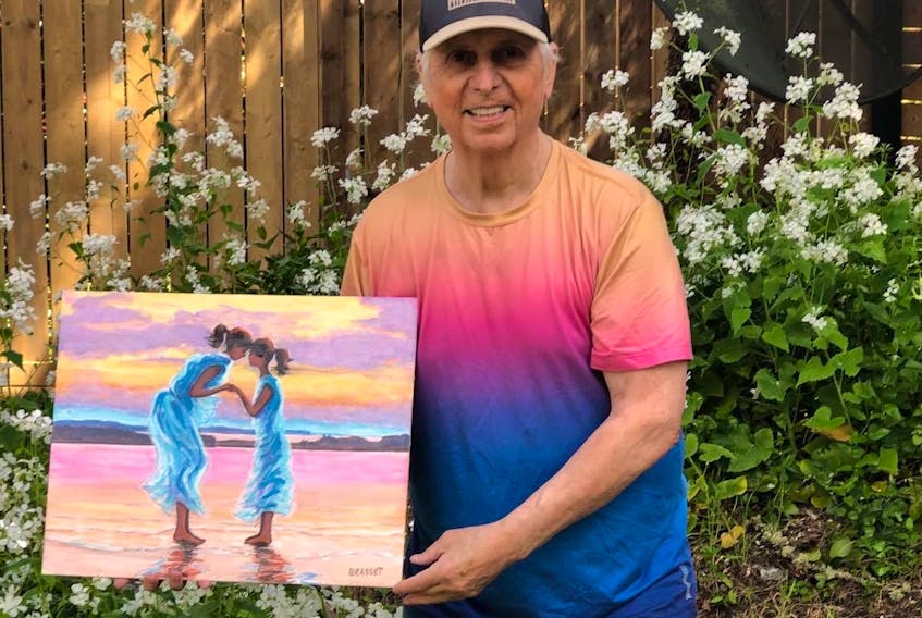 Painter Bob Brasset displays a painting of a mother and child clasping hands on a Nova Scotia beach, honouring the people lost in a string of tragedies in the province. Brasset, who now lives in British Columbia, is drawn to painting scenes of Nova Scotia that remind him of his childhood in Antigonish.