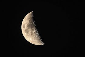 The moon, as it appears early in its first quarter, is a great time for amateur astronomers to get a closer look at details of the surface using binoculars or a telescope.