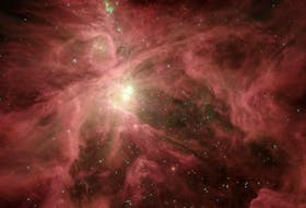 This image from NASA Spitzer Space Telescope shows the Orion nebula, our closest massive star-making factory, 1,450 lightyears from Earth. The nebula is close enough to appear to the naked eye as a fuzzy star in the sword of the constellation. - NASA