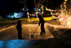 Aimee Maynard, who lives outside Corner Brook, N.L., has built a backyard rink for her daughter to help make memories. 