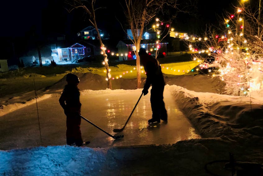 Aimee Maynard, who lives outside Corner Brook, N.L., has built a backyard rink for her daughter to help make memories. 