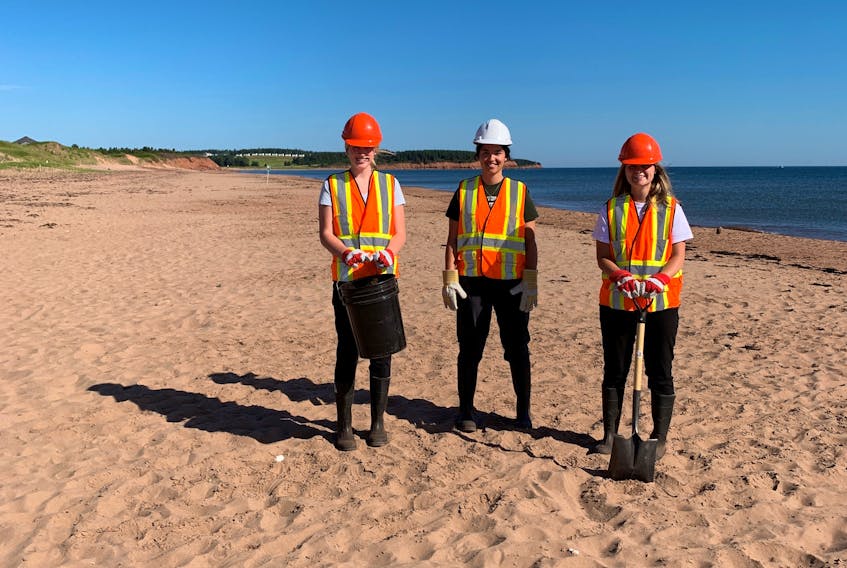Rebecca Green, left, Keanna Reid and Maddy Moffatt were hired by Government of Prince Edward Island to clean up the province’s shorelines this summer. Contributed.