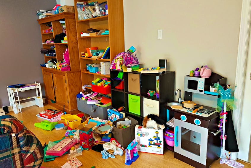 Pictured is a disorganized room before the cleanup by Wendy Stone, a professional organizer.