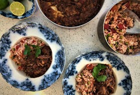 Chocolate, spices, nuts and pumpkin seeds all contribute to the deep flavours of chicken mole served with a Mexican-inspired rice. MARK DeWOLF PHOTO