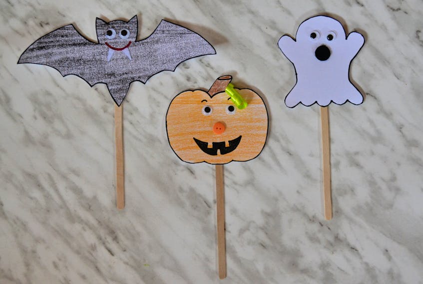Try drawing ghost, pumpkin and bat shapes onto a piece of cardstock for children to decorate, then attach a popsicle stick, allowing kids to play with their creations.