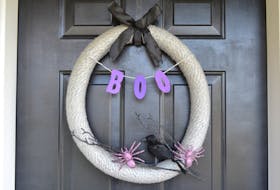 The base of this simple wreath is a pool noodle. Wrap the noodle with wool or fabric and attach the Halloween decorations of your choice.
