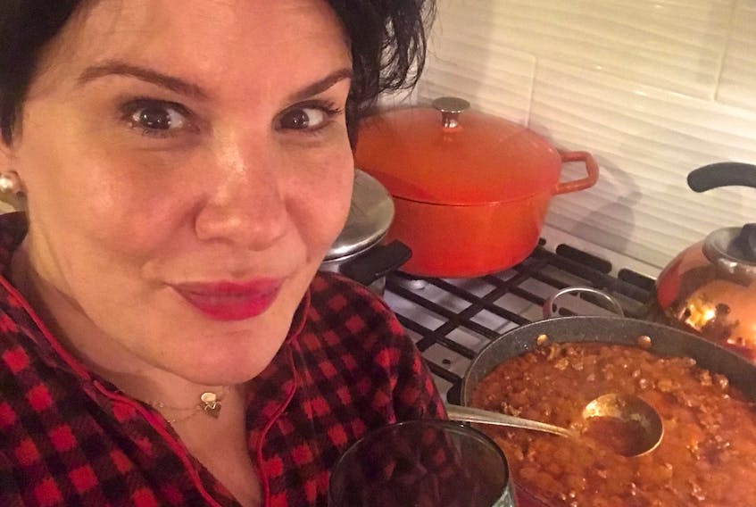 PJs, butter chicken and red wine - the perfect COVID-19 combo, says Emilie Chiasson.