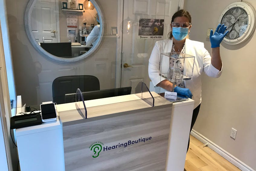 Jennifer Williams Saklofske, an audiologist at The Hearing Boutique in Kentville, N.S., says her workplace has made several changes under new COVID-19 protocols. They must now wear gloves, masks, and goggles whenever they come in physical contact with a patient.  