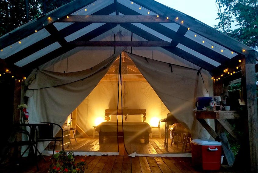 The solar glamping tents at Natura Wilderness are inviting after dark. CONTRIBUTED