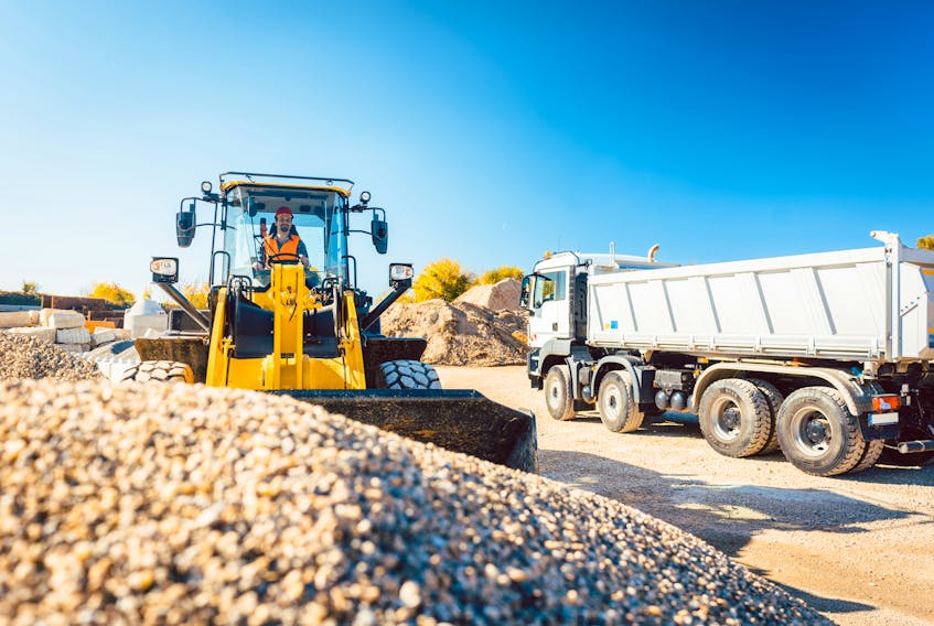 Columnist Heather Huybregts learned a little too late that moving rocks is much faster with a loader than a shovel. 123rf Stock
