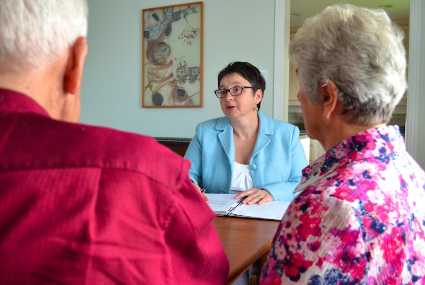 Marie-Claire Chartrand (centre) says video calls are the best means of connecting with seniors and checking on their physical and mental health when in-person visits are not possible. 