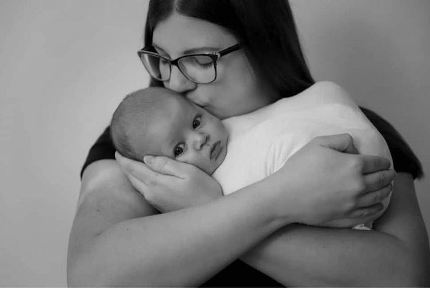 Andrea Wheeler with her newborn son, Cameron. Due to COVID, the new mom from Newfoundland says her husband had to leave the hospital four hours after their child was born. 