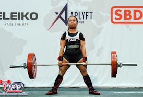 World champion powerlifter Maria Htee said it's a great feeling to know she can lift more than most men at her gym. — CONTRIBUTED