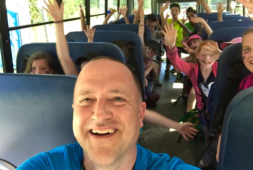 Boys and Girls Club of Greater Halifax chief executive officer Hank van Leeuwen on a bus during better times. Since COVID-19 forced the closure of clubs, the organization has worked to find alternative ways to deliver programming.